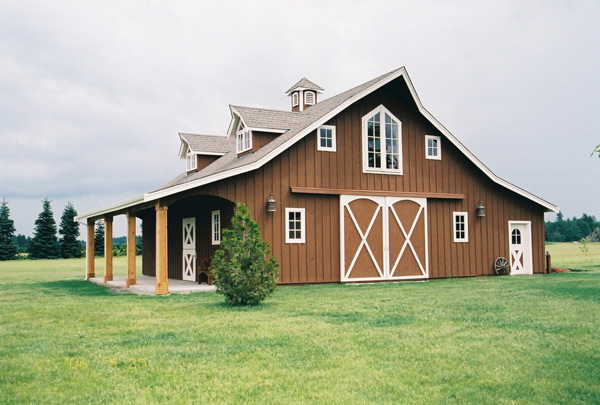 gable barn with cupolas and side sheds